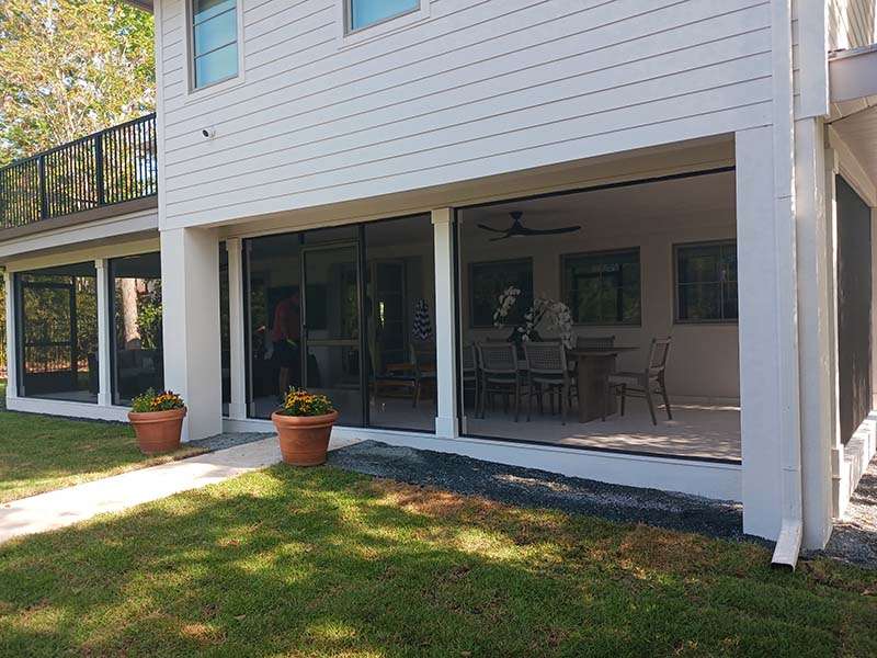 extended patio enclosure with panoramic screens and balcony back